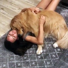 gril playing with cute dog