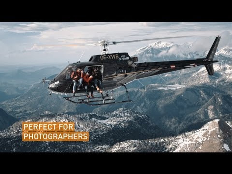 Daredevils Fly Helicopter With Open Doors Over Austrian Alps