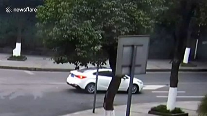 Scooter driver sent spinning over car roof