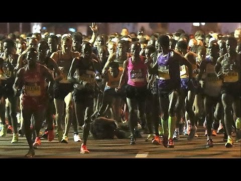 Kenenisa Bekele falls at the start of the 2017 Dubai Marathon