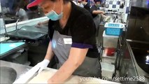 Hong Kong Street Food. Cooking Fried Loaves of Bread. Action in the Kitchen of a Chiense Restaurant