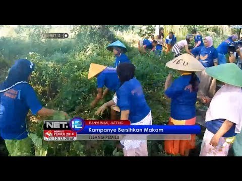 NET12 - Partai Nasional Demokrat kampanye membersihkan tempat pemakaman umum