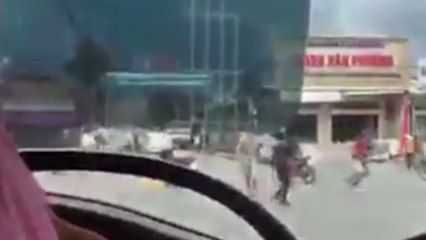 Two youth groups fighting on the road in Vietnam