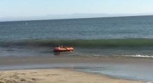 Guy Tries To Land His Raft At The Beach, Fails Miserably