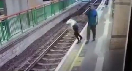 Man Pushes Woman On The Tracks For No Reason