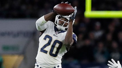 Palmer breaks left arm on interception by Joyner