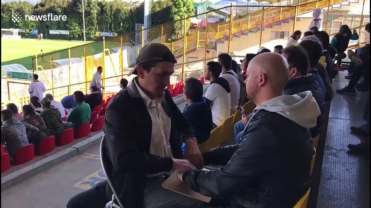 Deaf-blind man enjoys soccer match with the help of his interpreter