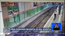 Pria Dorong Wanita ke Rel Kereta