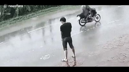 Man relieving himself on road splattered when lorry passes by