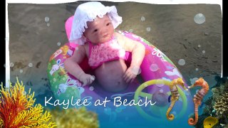 Silicone Baby Kaylee swimming at beach