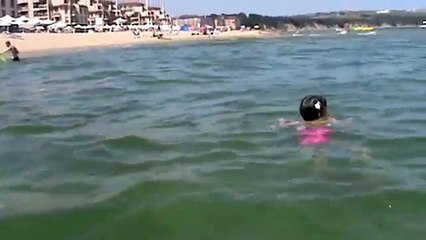 Little fish girl swimming underwater in Black Sea (4 years)