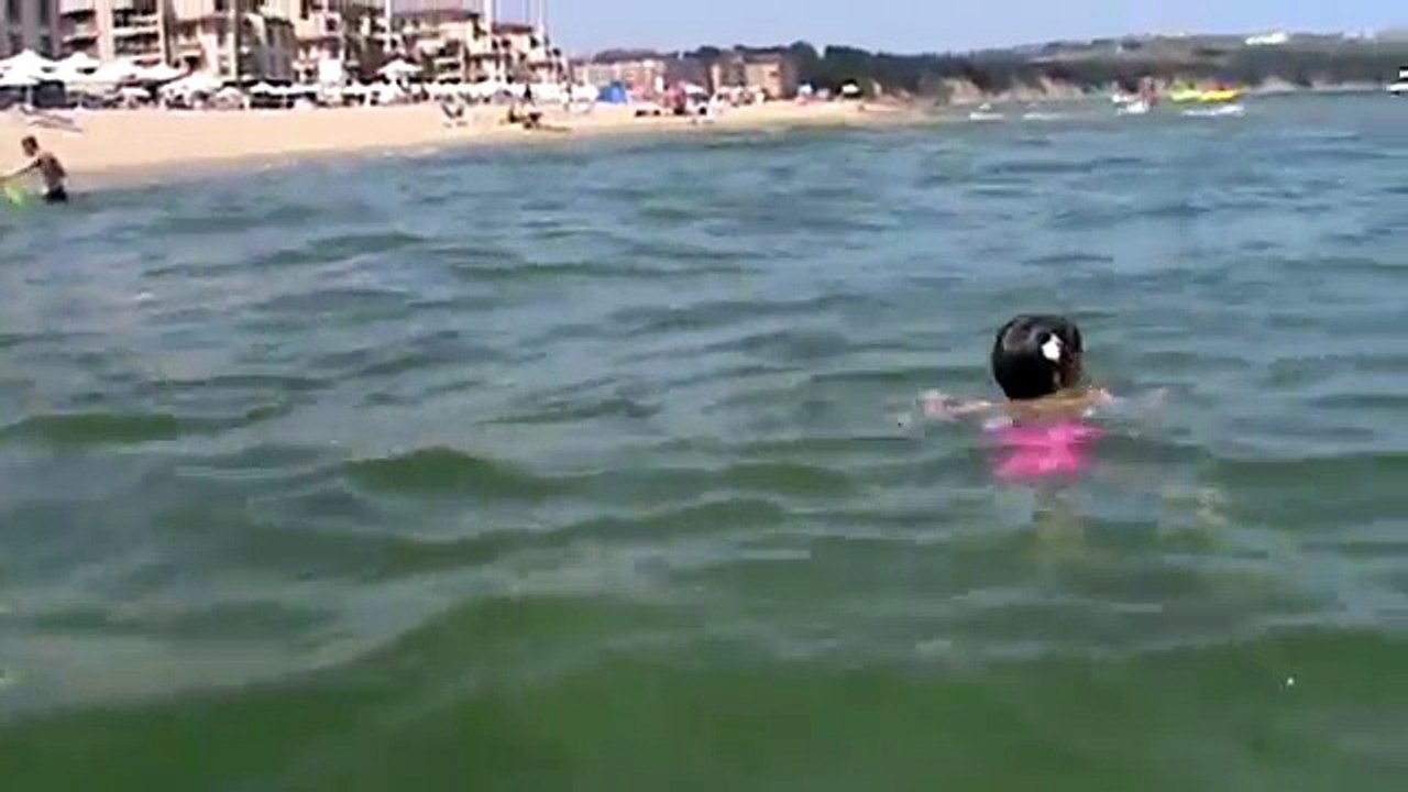 Little fish girl swimming underwater in Black Sea (4 years)