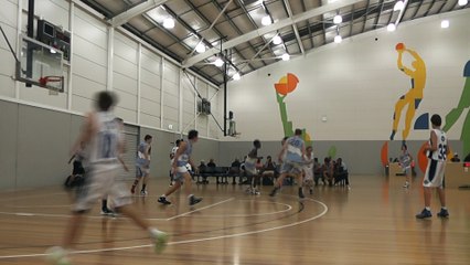 Kid Throws Full Court Shot in Basketball Game