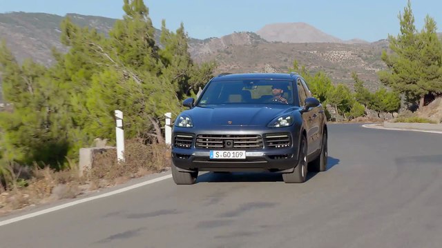 Porsche Cayenne Biskaya Blue Metallic Driving on the road