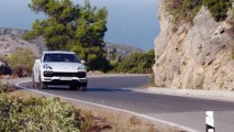 Porsche Cayenne Turbo Carrara White Metallic Driving on the road
