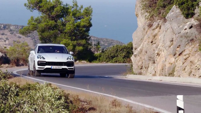 Porsche Cayenne Turbo Carrara White Metallic Driving on the road