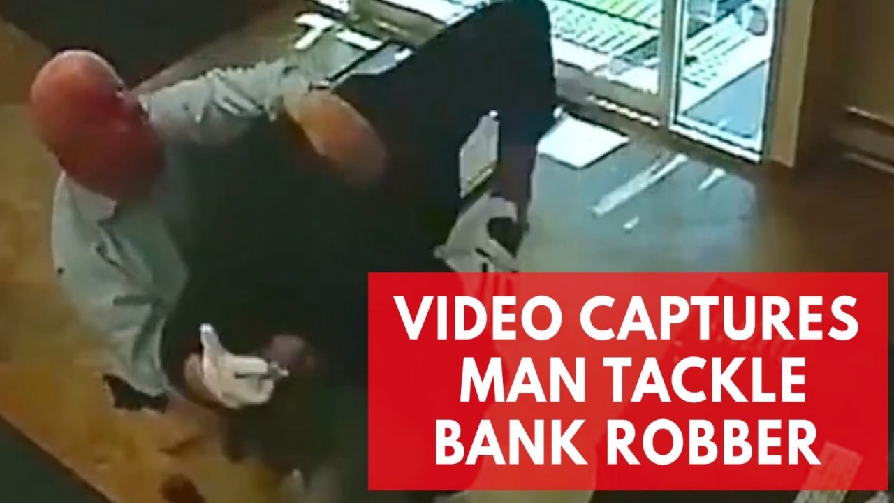 Watch dramatic moment man tackles armed bank robber like a pro football player