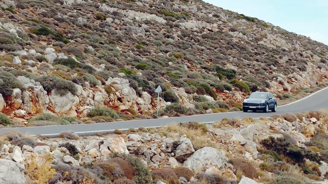 Porsche Cayenne S Biskaya Blue Metallic Driving on the road