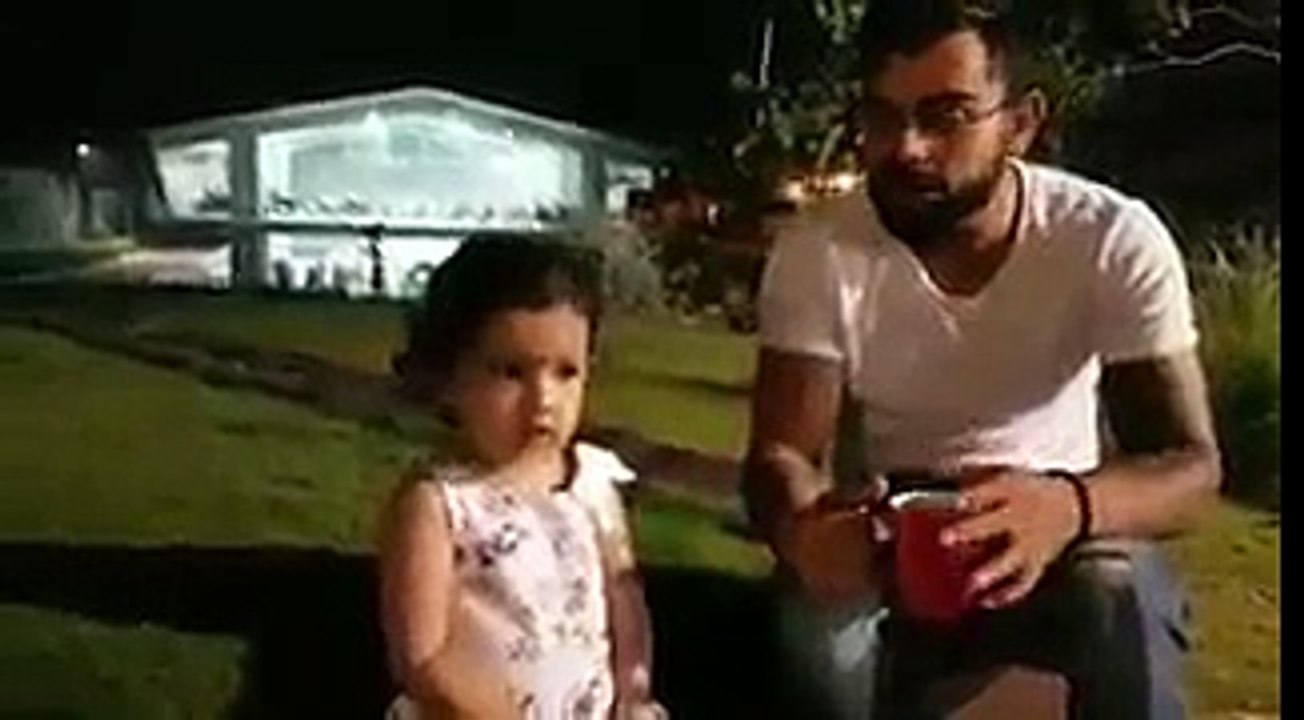Virat Kohli playing with dhoni daughter