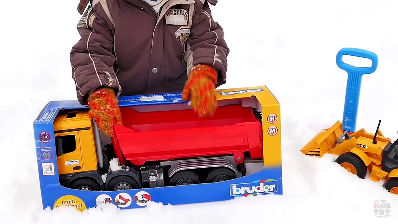 BRUDER tip truck in a snowy forest. Playing with BRUDER toys. Mercedes-Benz. Video for kids-0s1_D5v6kJk