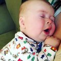 Cute baby says _oh no_ after sneezing