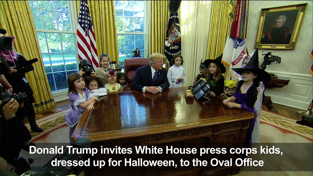 Trump throws jabs at journalists in front of Halloween-clad kids