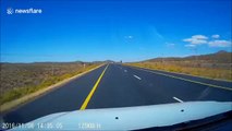 Trailer blown by wind smashes oncoming car windscreen