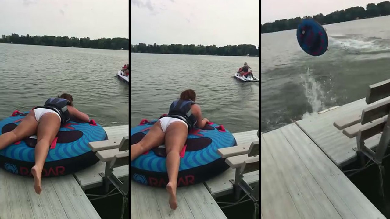 Une fille veut faire de la bouée tractée par un jet ski..