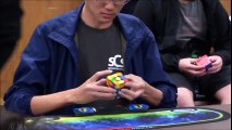 Young Dude Beats The World Record For Solving a Rubik's Cube