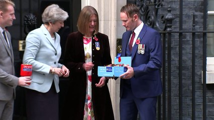 Theresa May purchases her RBL poppy