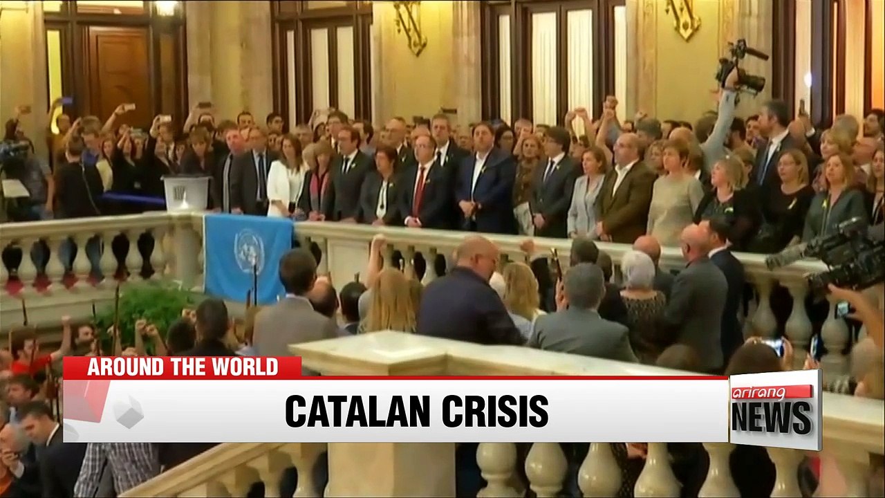 Deposed Catalan leader Carles Puigdemont flees...