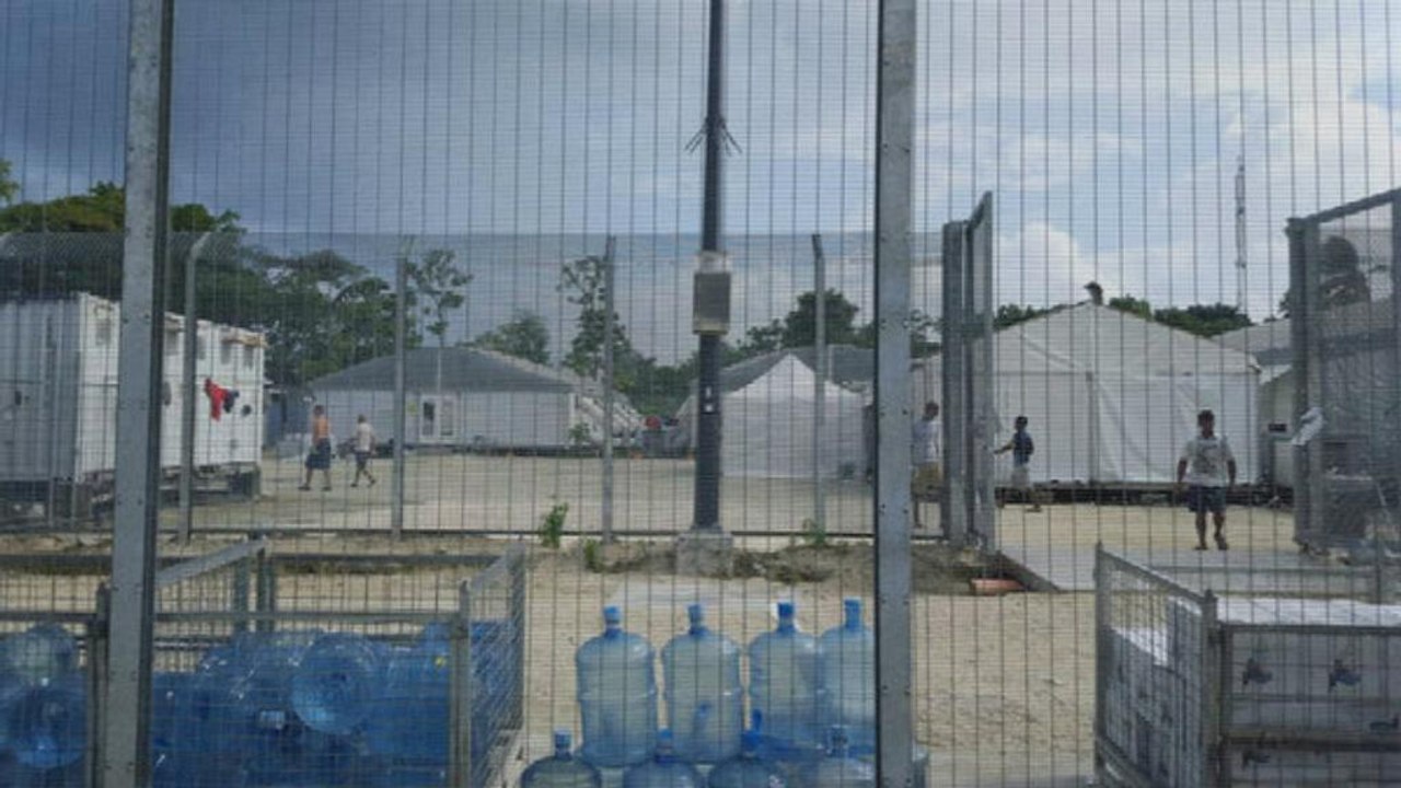 Tensions rise as refugees refuse to leave Australian camp in Papua New Guinea amid safety fears