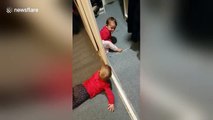 Adorable baby twins discover peek-a-boo