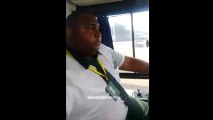 Bus driver taking a selfie while driving