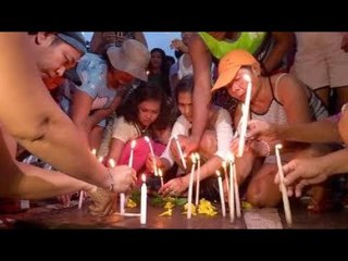 Kadamay lights candle for a drug war victims on All Saints’ Day