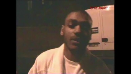 A young KANO appears, late night, in an Adidas bathrobe