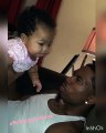 Cute baby girl loves blowing spit bubbles with Dad