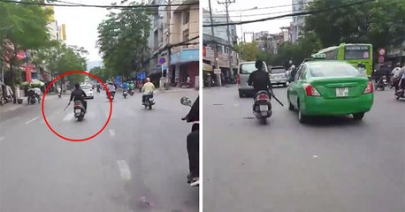 Crazy Guy On A Moped Filmed Attacking Cars With A Machete