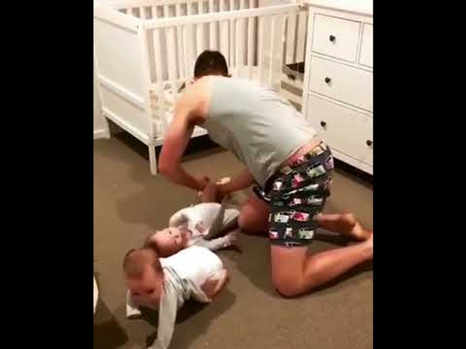 Dad Has His Hands Full While Getting Daughters Ready For Bed