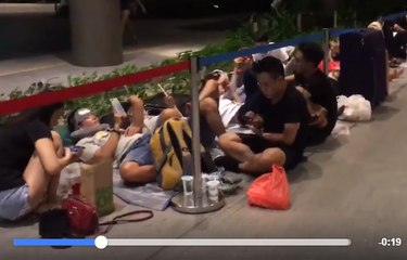 People Stare at Phones as They Camp Out Overnight for iPhone X