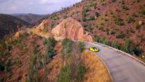 Porsche 911 GT2 RS in Racing Yellow Driving on the road