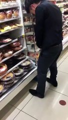 Drunk man urinates on food products in a convenience store