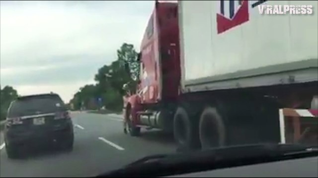 Policeman Clings To Runaway Truck During Chase