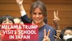 Melania Trump visits school in Tokyo, writes 'peace' in calligraphy