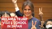 Melania Trump visits school in Tokyo, writes 'peace' in calligraphy