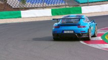 Porsche 911 GT2 RS in Miami Blue Driving on the track