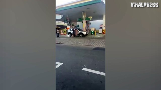 Woman Tries To Get In Car At Petrol Station