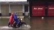 Motorbikes Speed Through Hue's Flooded Streets