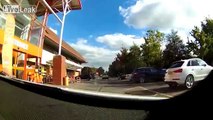 Angry old driver cuts up another driver in a car park