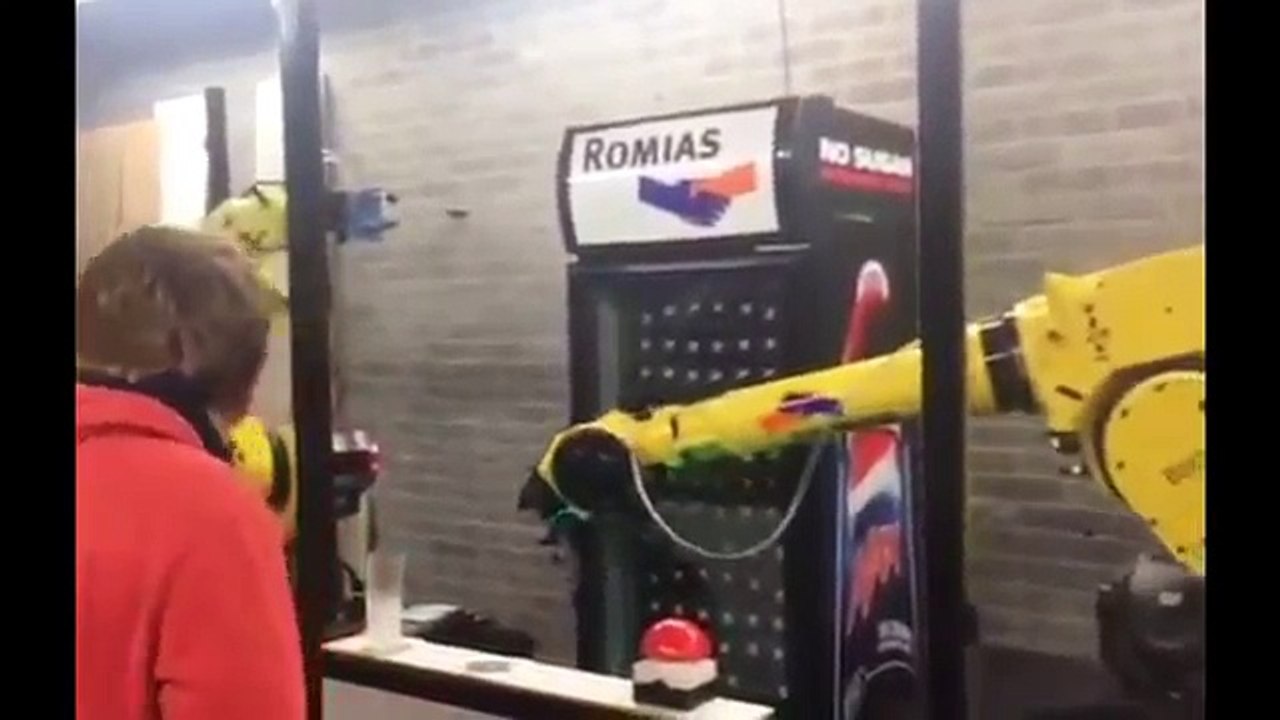 Perfect beer pour by two robotic arms